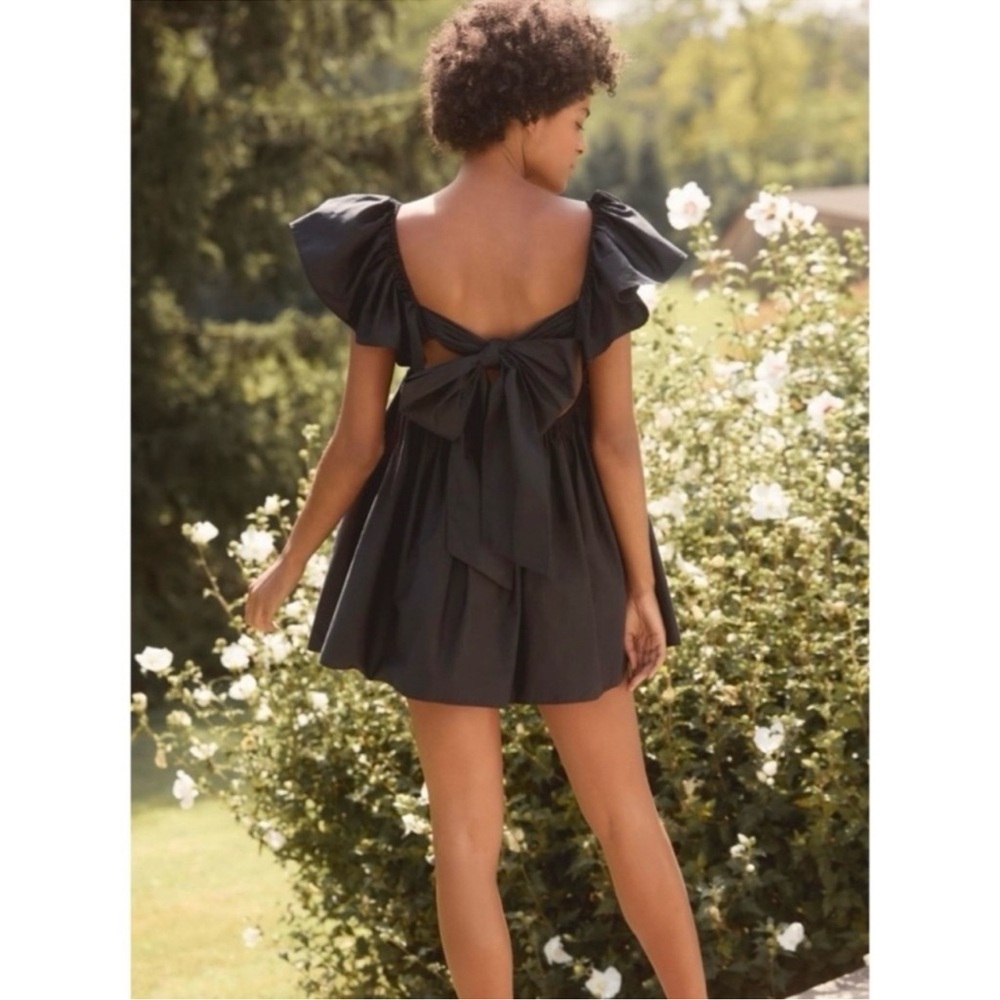 Anthropologie black ruffle sleeve open tie back mini dress